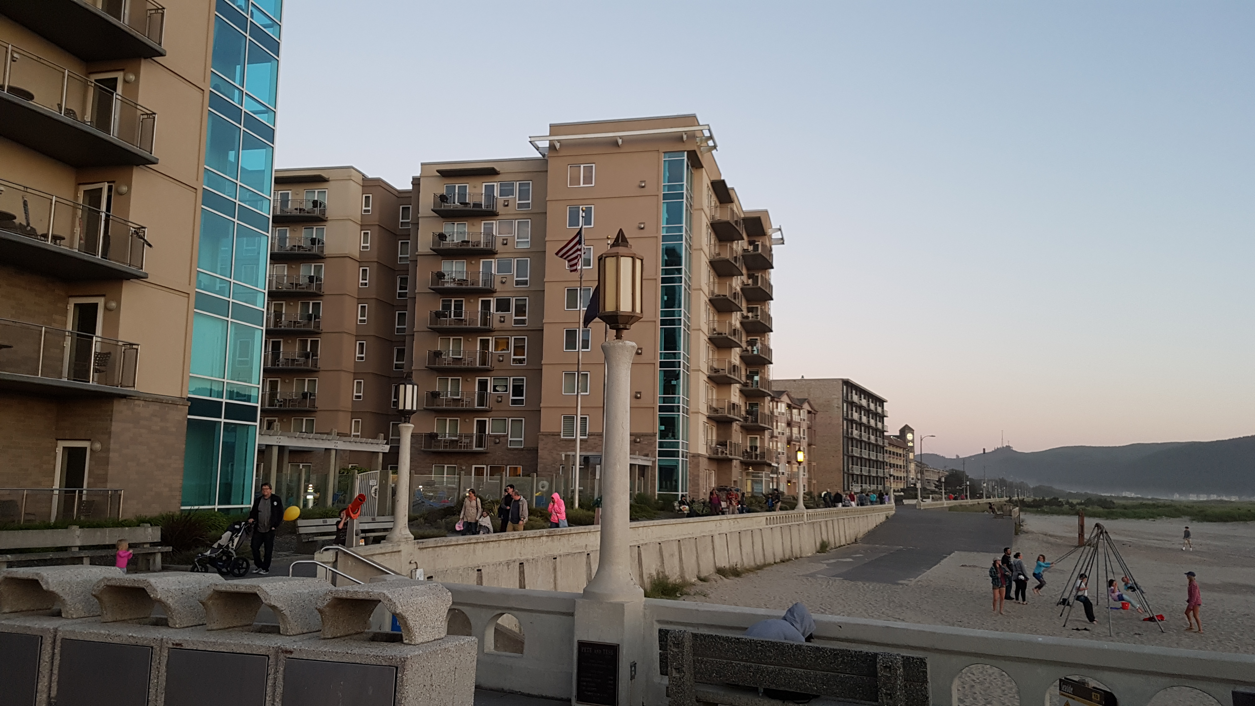 the promenade at Seaside Oregon, stretching down the beach in front of hotels.